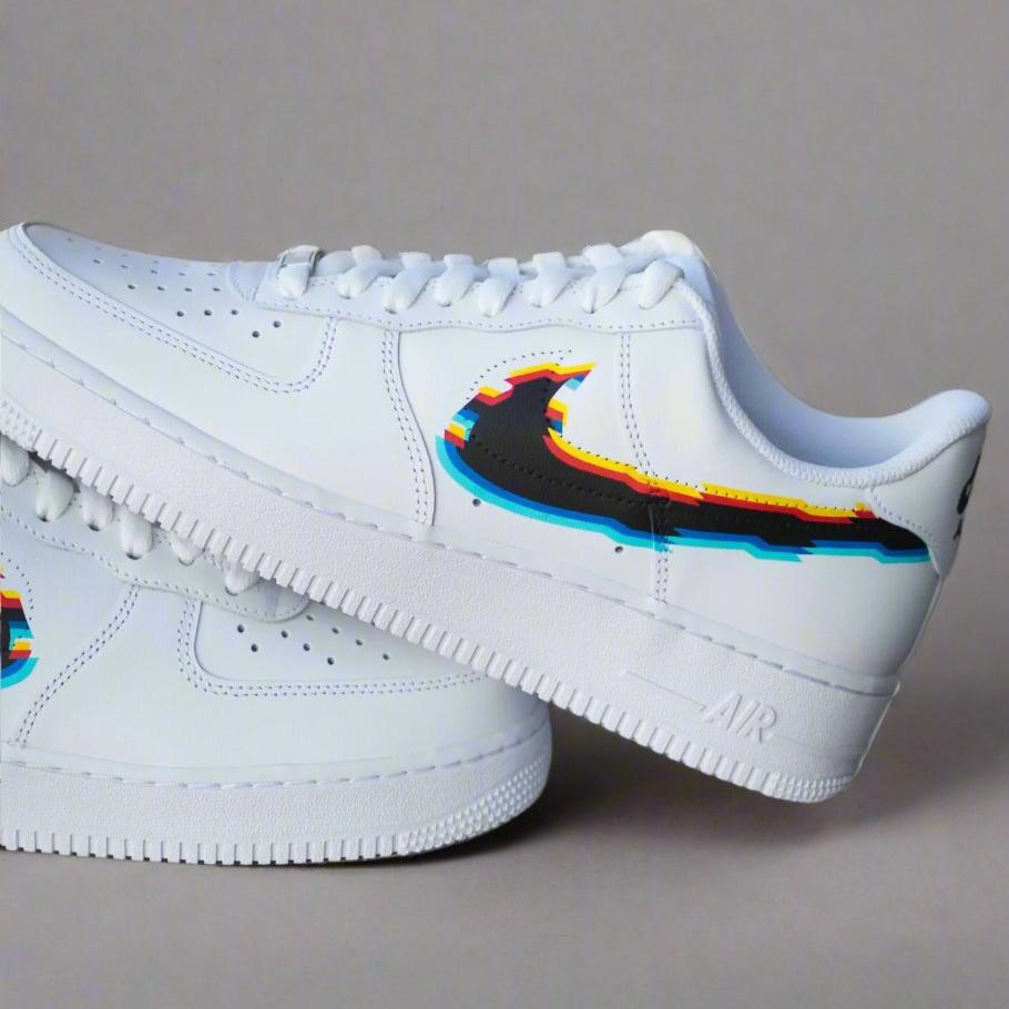 White streetwear sneaker with colorful glitch-effect swoosh logo, side profile on gray background