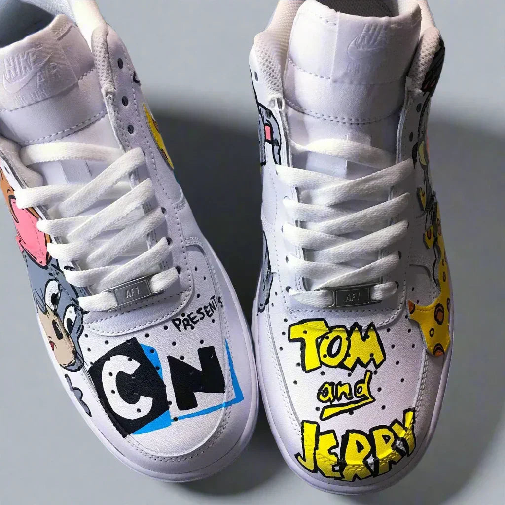 White custom sneakers with Tom and Jerry cartoon graphics and colorful streetwear art