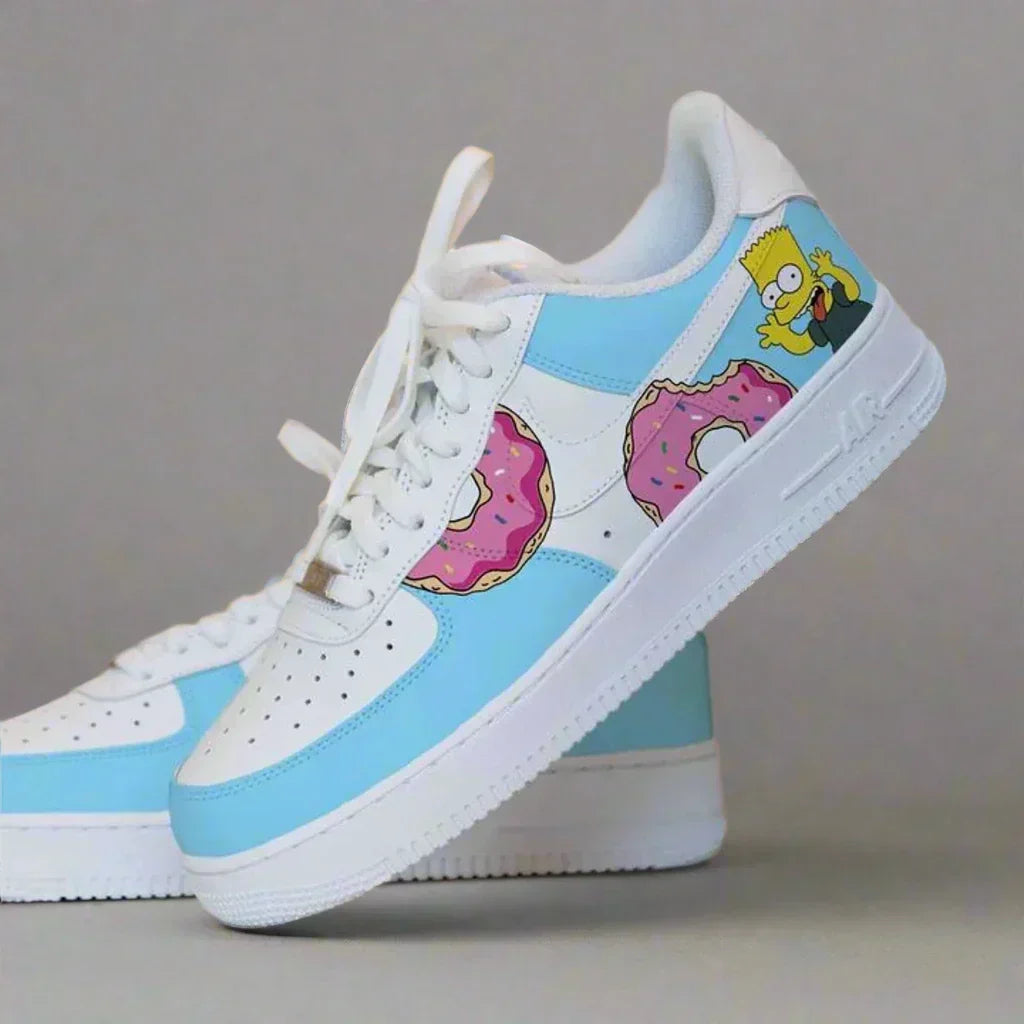 Custom white and light blue sneaker featuring cartoon donuts and cartoon character graphic.