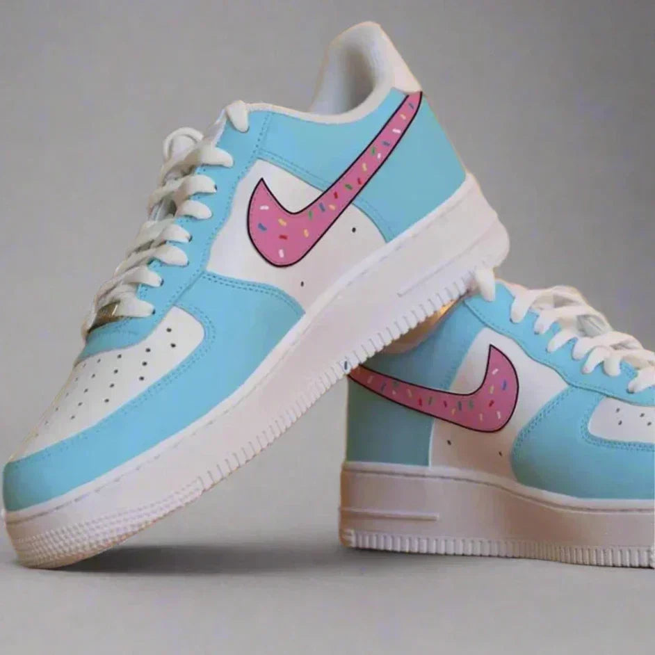 Blue and white streetwear sneakers with pink swoosh and colorful sprinkle design