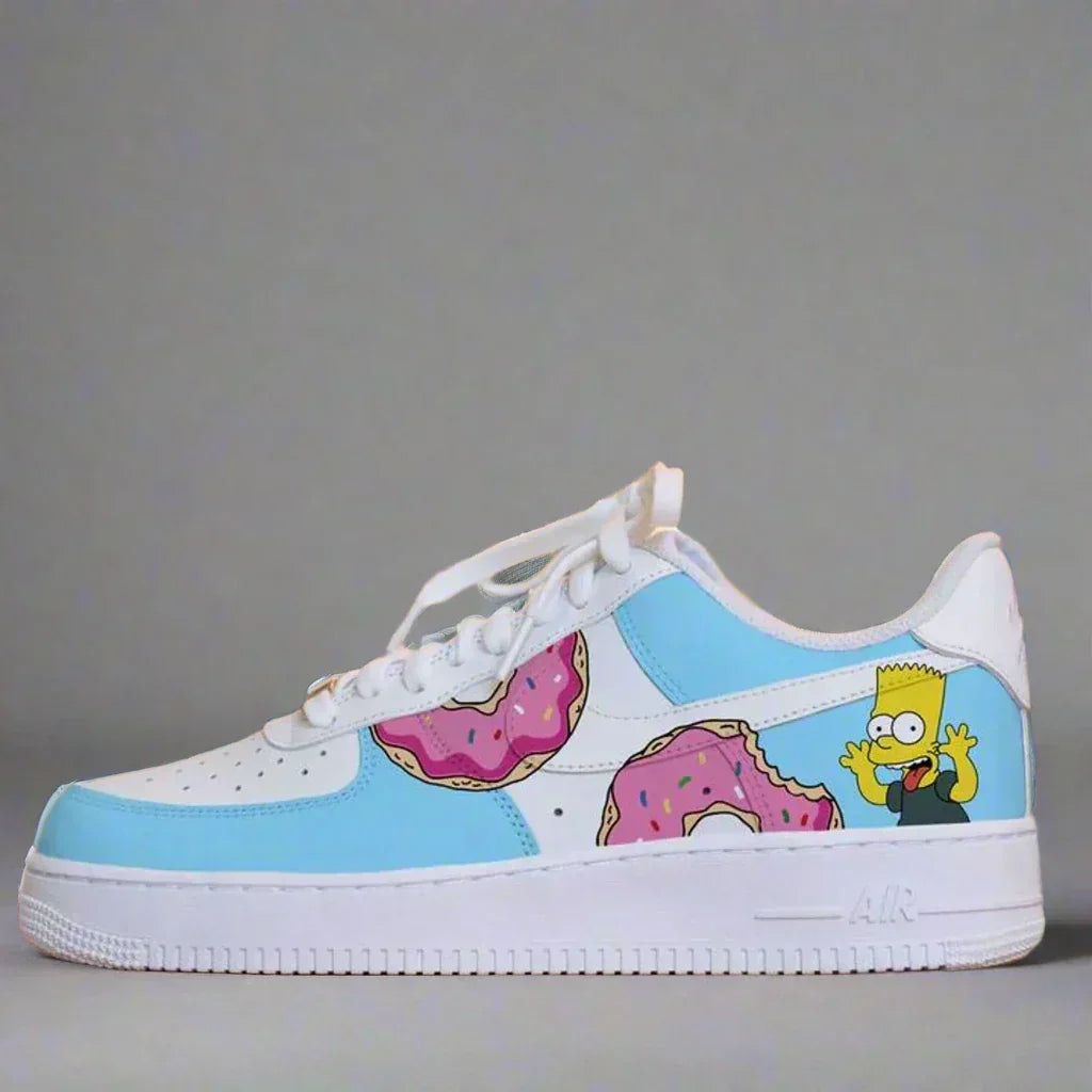 Custom white sneaker with blue panels, cartoon donuts, and animated character graphic