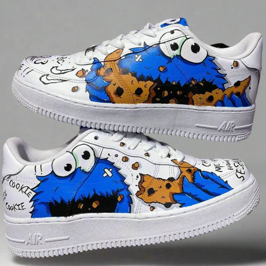 White custom sneakers with blue cartoon character and cookie graphic design, streetwear style