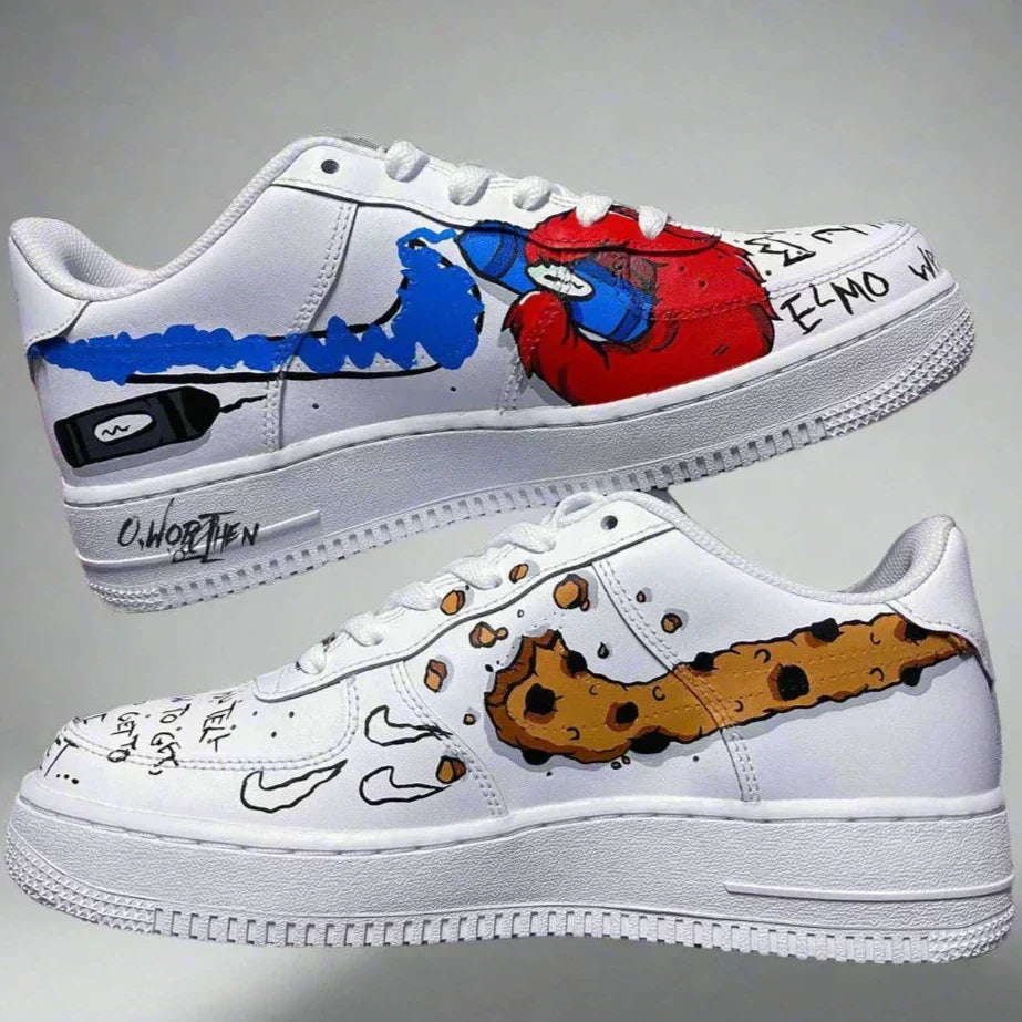 Custom white sneakers with cartoon-inspired blue and red graffiti artwork and a cookie design.