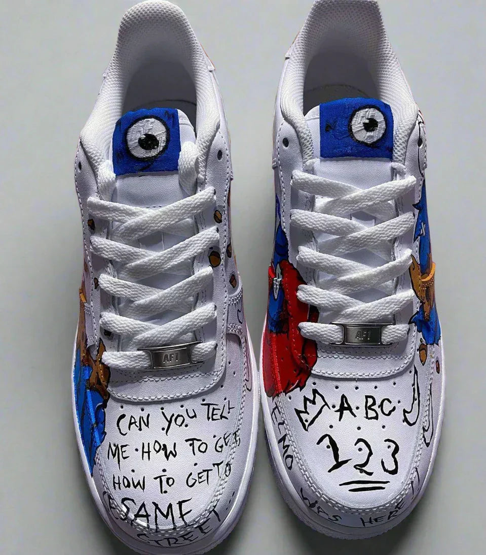 Custom white streetwear sneakers featuring hand-drawn cartoon designs and playful graffiti text.