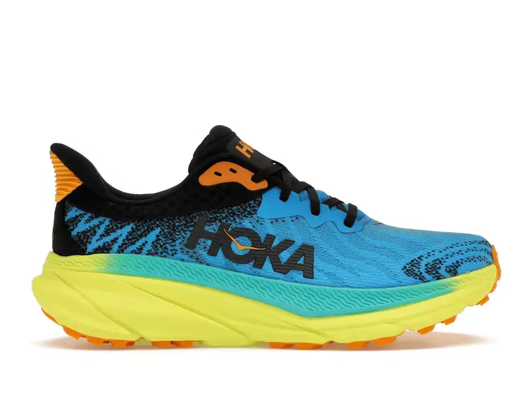 Blue and yellow Hoka running shoe with black and orange details, thick cushioned sole