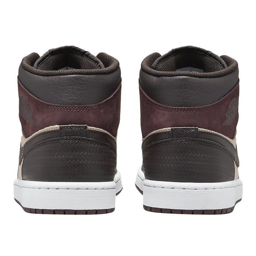 Back view of Air Jordan 1 Mid sneakers in brown, maroon, and beige leather with white soles