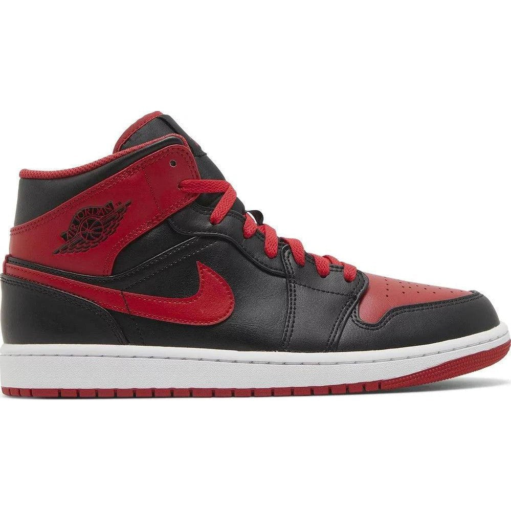Black and red Nike Air Jordan 1 Mid sneaker with white sole, classic streetwear style