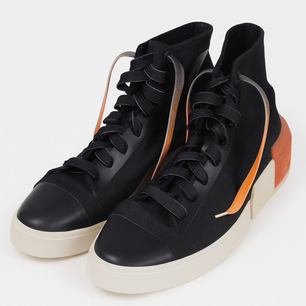 Black high tops worn with Gradient Shoelaces that go from deep black to vibrant orange shown in a white background