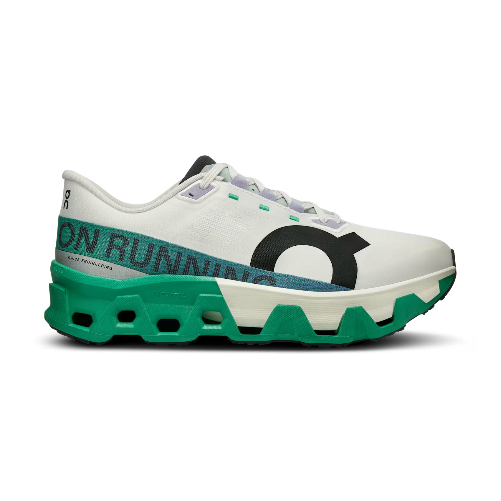 White and green designer sneaker with bold sole, visible ON RUNNING text, and breathable mesh upper