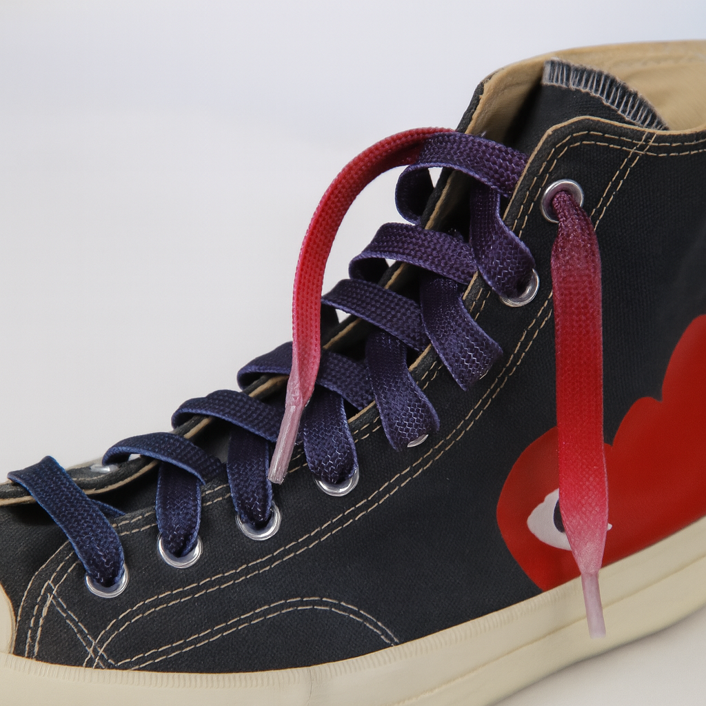Close up of a sneaker with Red - Purple - Light Pink Gradient shoelaces on the shoe