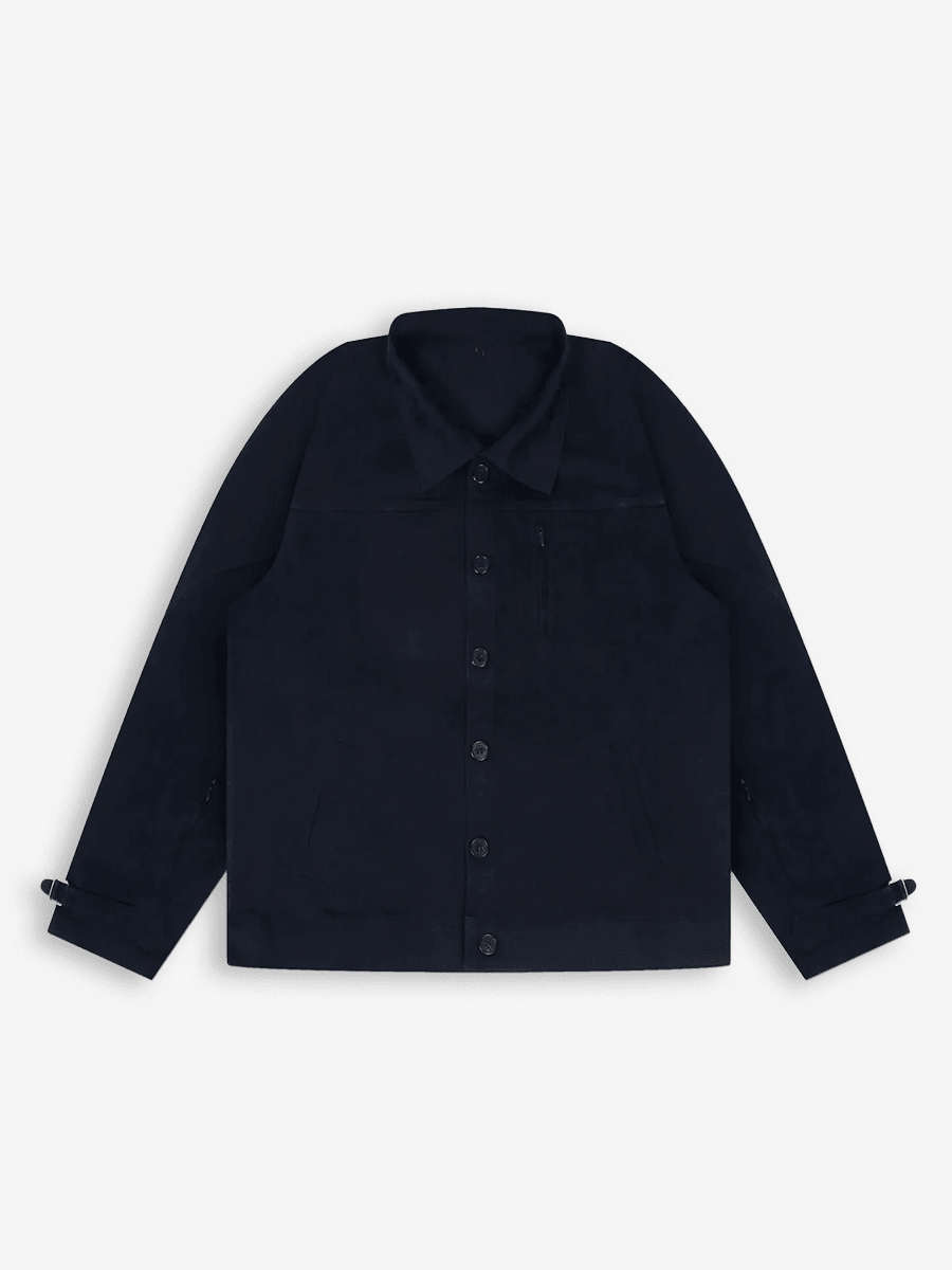 Black button-up streetwear jacket with long sleeves and a classic collar, laid flat on white background