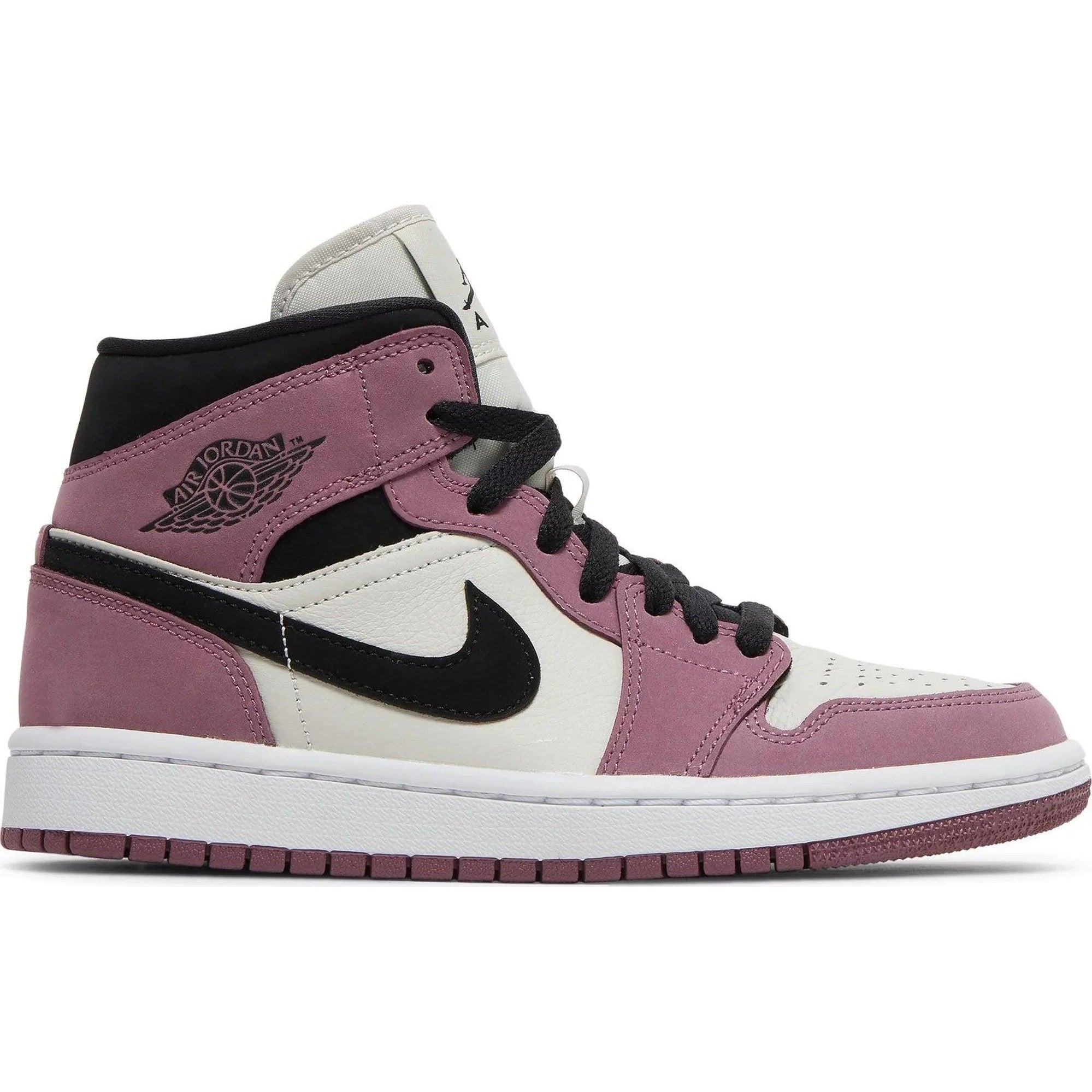 Air Jordan 1 Mid SE sneaker in berry pink, black, and white, side profile view