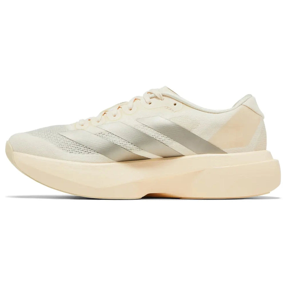 Cream low-top sneaker with sleek mesh upper, cushioned sole, and neutral minimalist design