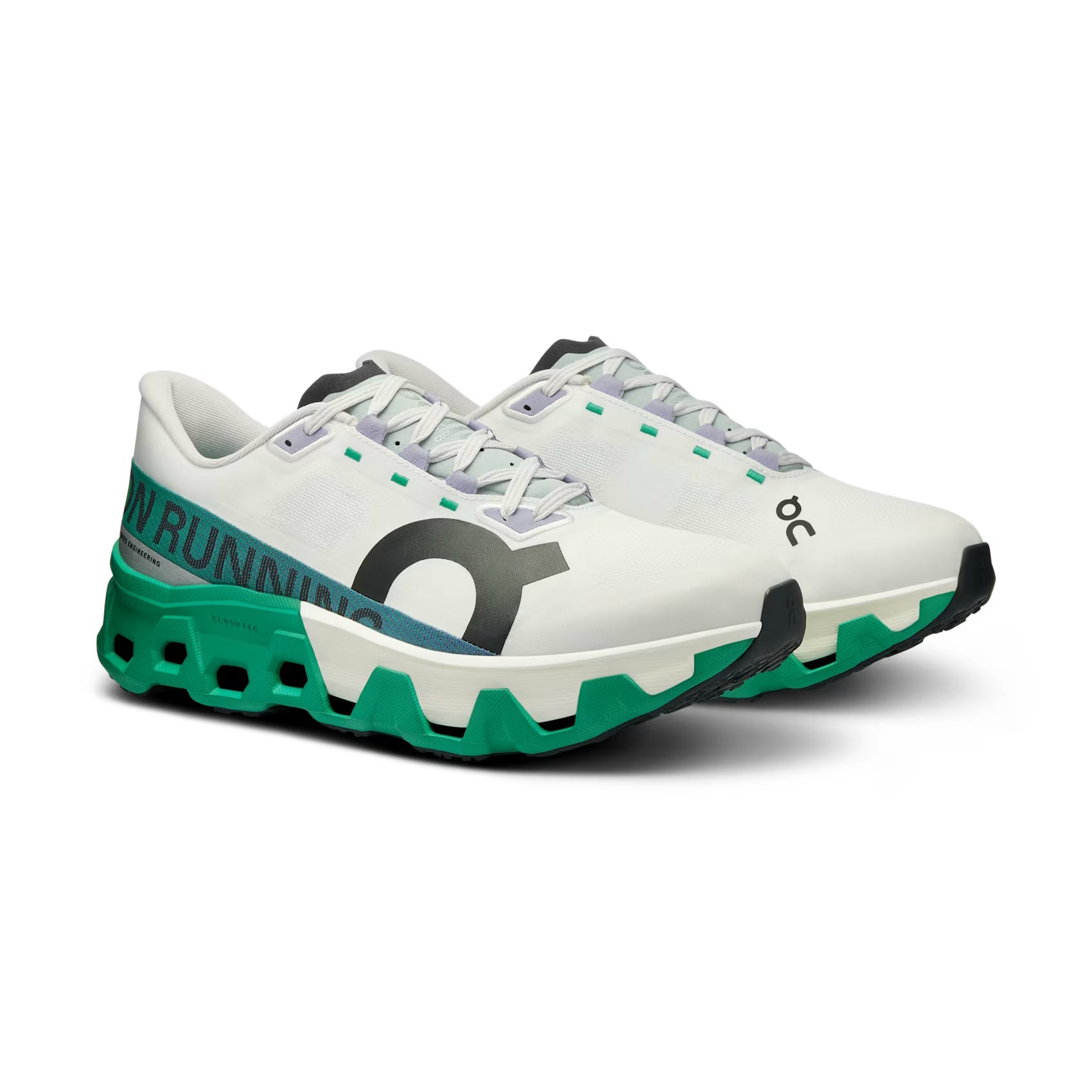 White and green designer running sneakers with black logo and chunky sole on white background