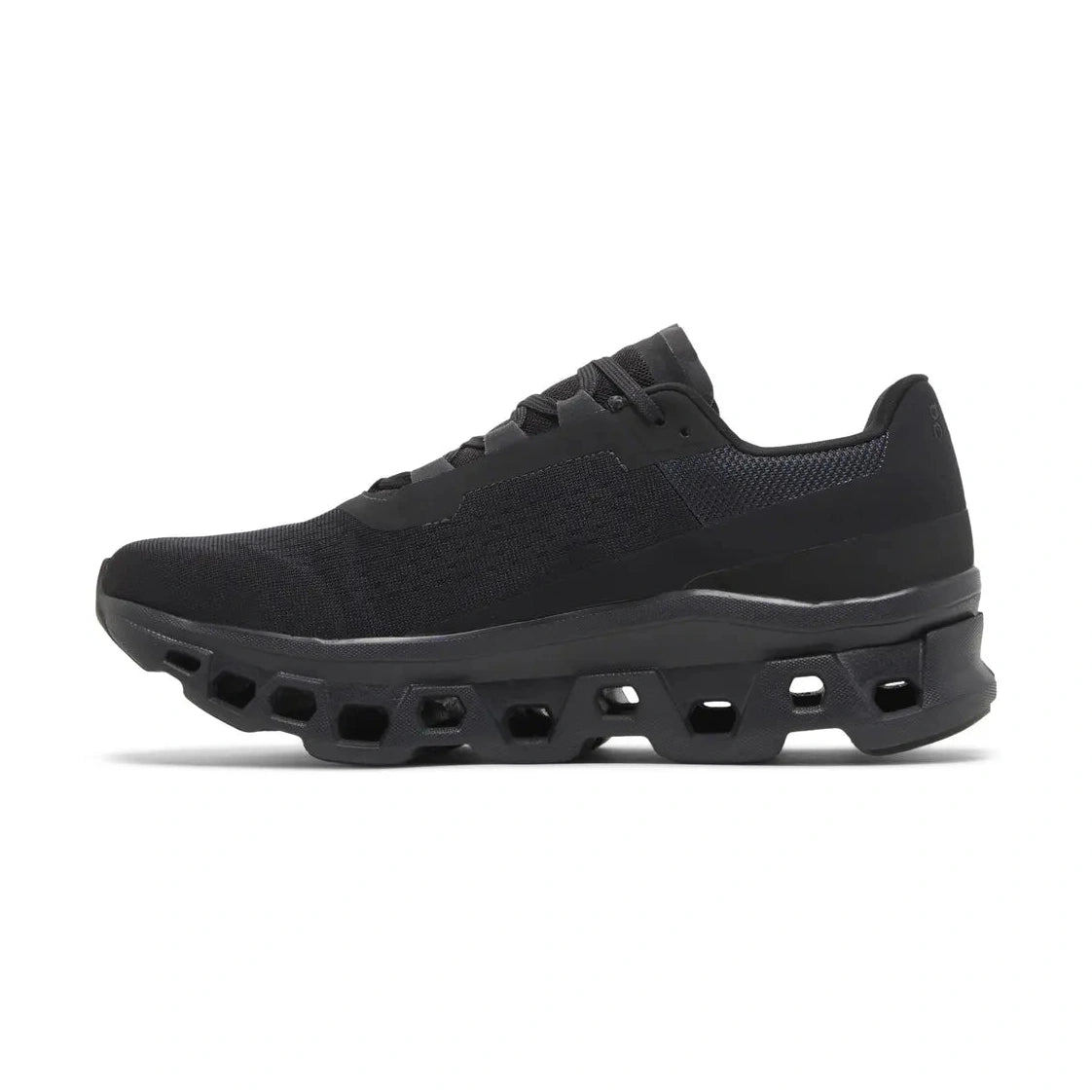 Black streetwear sneaker with mesh upper and chunky geometric sole, side view