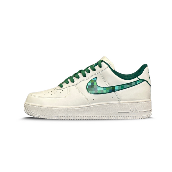 White low-top sneaker with green laces and a pixelated green Nike Swoosh logo on the side