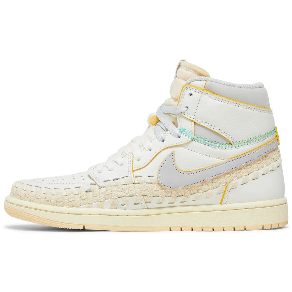 White high-top sneaker with beige suede accents, visible stitching, and light gray Swoosh logo