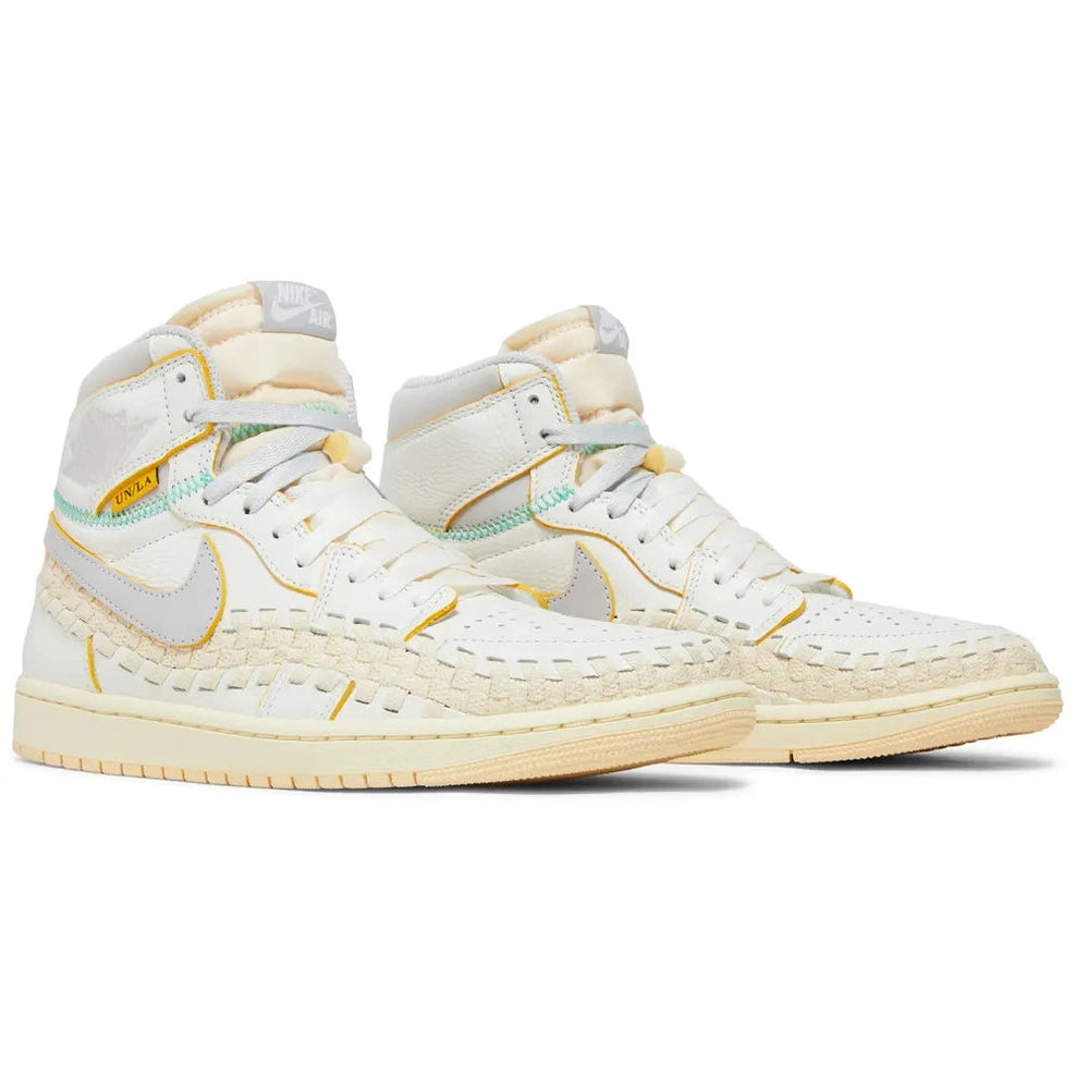 White high-top designer sneakers with woven detailing and yellow accents on a white background