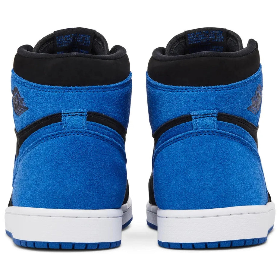 rear view of blue and black high-top suede sneakers with white midsoles