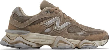 Brown New Balance sneaker with suede and mesh panels, chunky sole, and side logo