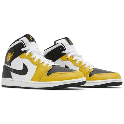 Yellow, black, and white high-top sneakers with white laces and black swoosh logo