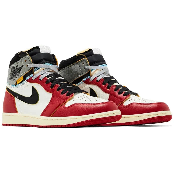 Red, white, and black high-top sneakers with unique stitching and layered detailing