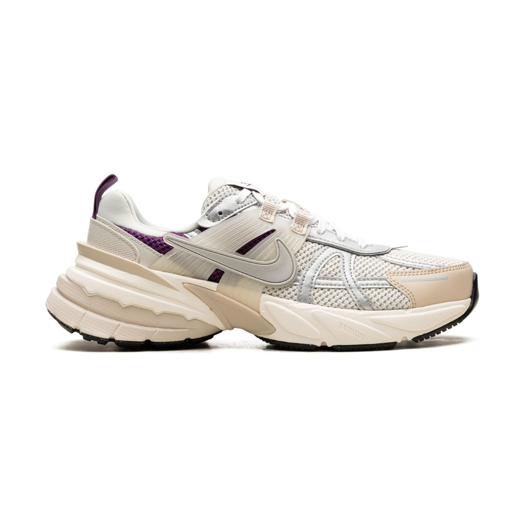 White and purple sneaker on a white background