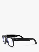Black wayfarer sunglasses with clear lenses and visible Ray-Ban logo on the temple