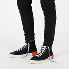 Black high-top sneakers with white - blue - green gradient shoelaces shown on a white background 