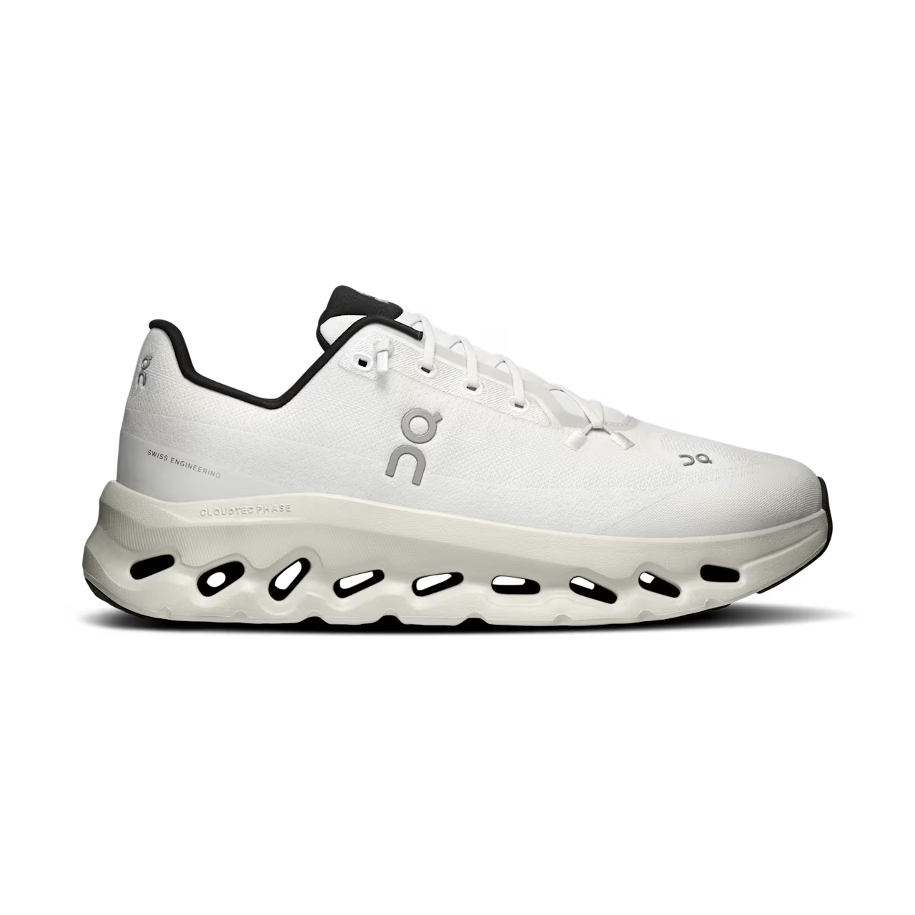 White designer sneaker with breathable mesh upper and unique cushioned sole, side view.