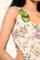 Floral tapestry crop top with green ribbon shoulder ties, streetwear fashion detail
