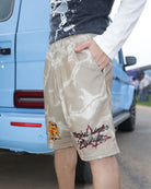 Side view of Fearless Under Everything Mad-Max Shorts showing detailed patches and patterns.