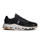 Black and white low-top sneaker with mesh upper, CloudTec sole, and modern streetwear design