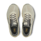 Top view of beige On Cloudmonster sneakers with mesh upper and grey laces