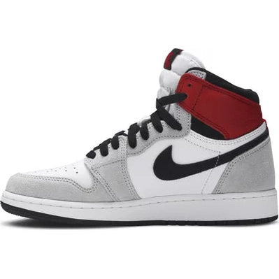 High-top streetwear sneaker with white, grey, and red suede panels and black Swoosh logo