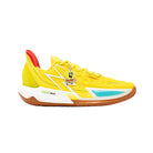 Yellow sneaker with a character charm on a light gray background