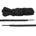 A pair of flat black shoelaces, displayed in a coiled form, alongside a straightened out section showing the flat shape and texture.