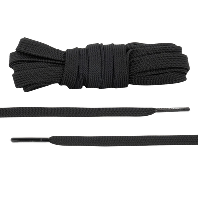 A pair of flat black shoelaces, displayed in a coiled form, alongside a straightened out section showing the flat shape and texture.