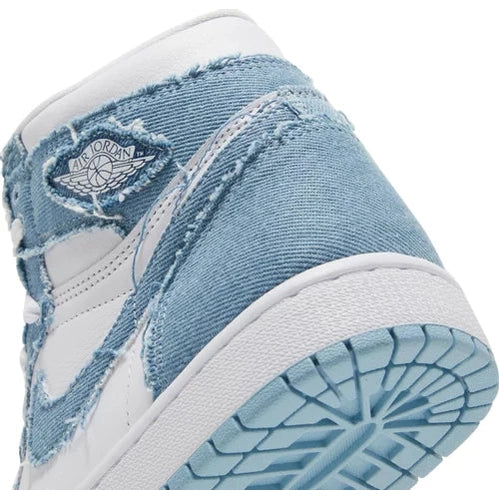 Close-up of Air Jordan sneaker with distressed blue denim and white leather details