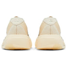 Back view of beige and cream Adidas sneakers with cushioned soles, streetwear footwear