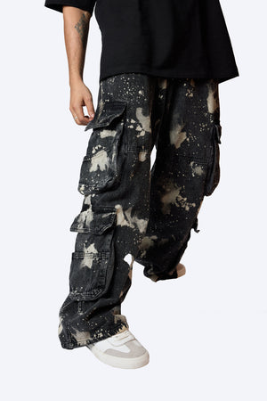 Dark wash black denim cargo pants with Hypo bleach effect.