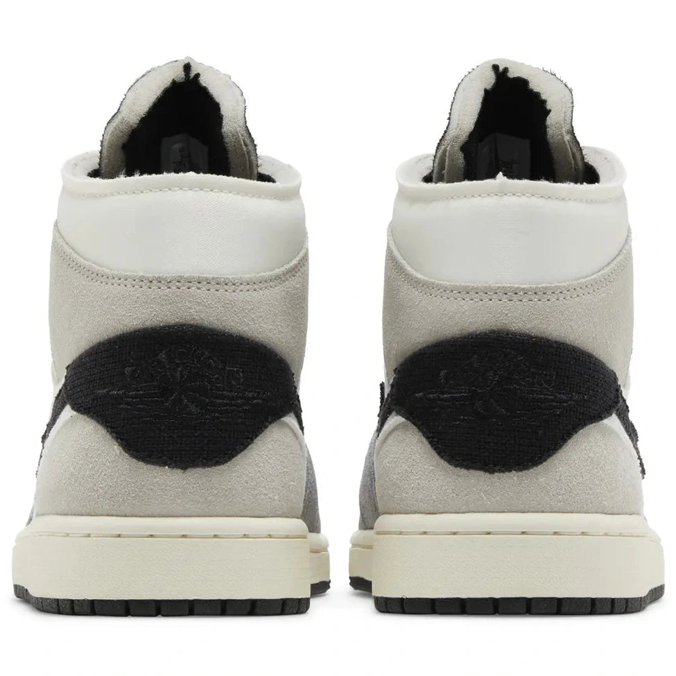Rear view of Air Jordan 1 Mid SE Craft Inside Out sneakers in grey suede with black accents