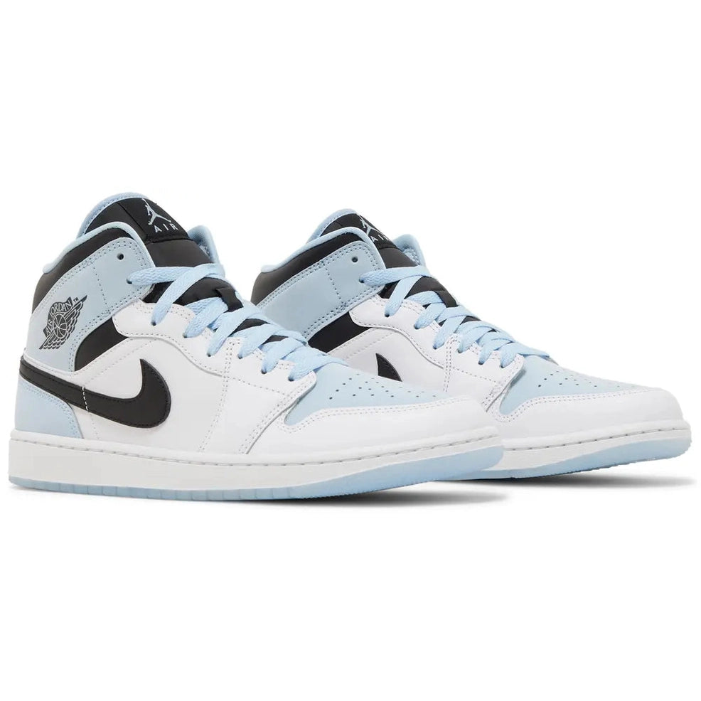 White and ice blue mid-top sneakers with black swoosh and light blue laces, streetwear shoes