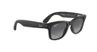 Black polarized designer sunglasses with dark lenses on a gray background