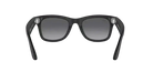 Black rectangular sunglasses with dark gradient lenses on a gray surface