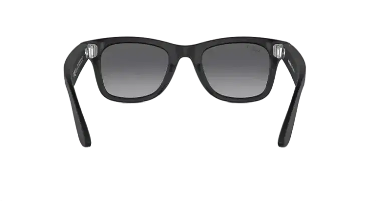 Black rectangular sunglasses with dark gradient lenses on a gray surface
