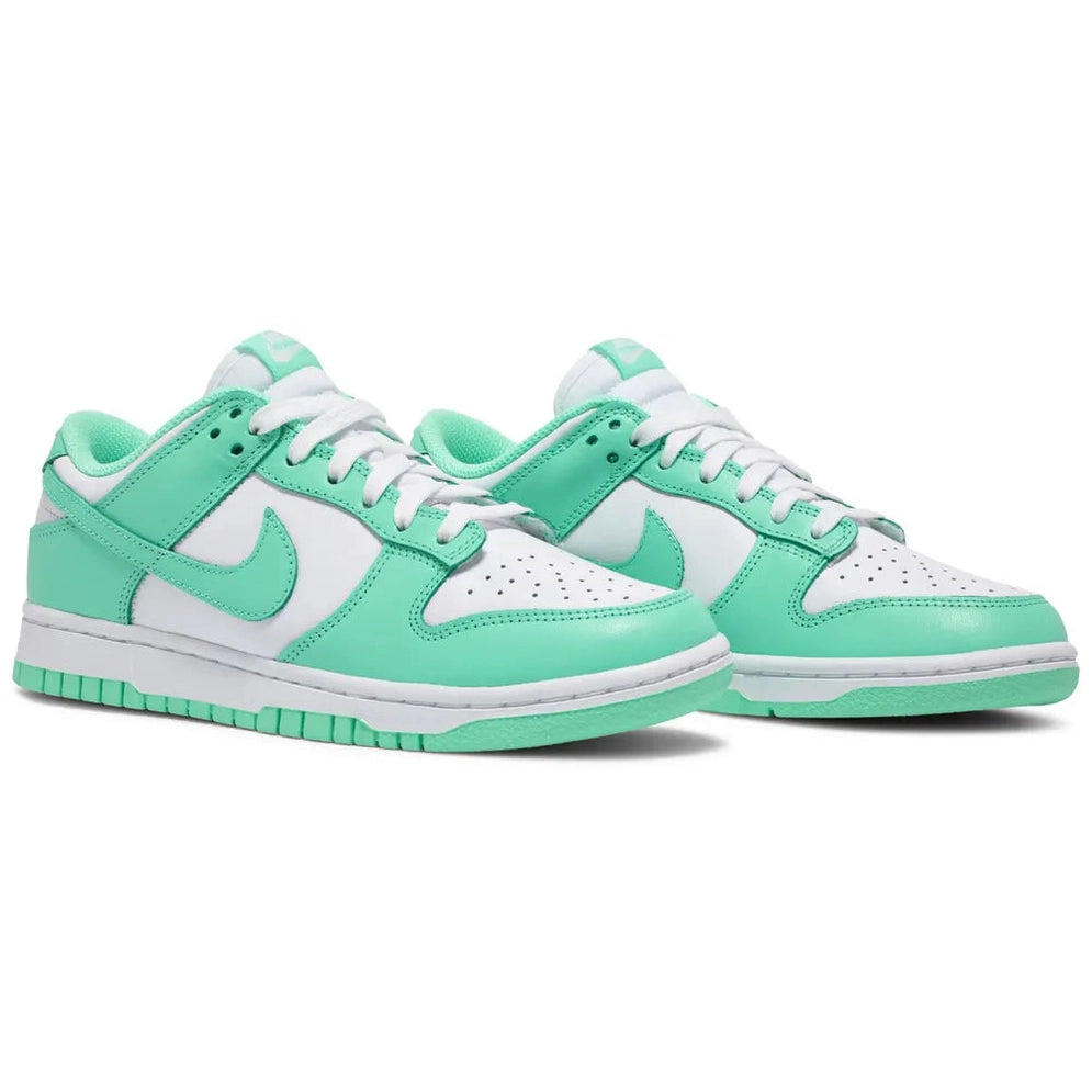 Mint green and white low-top sneakers with leather upper and white laces on a white background
