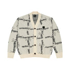 Light gray cardigan with black chain link pattern and cream ribbed collar, cuffs, and hem