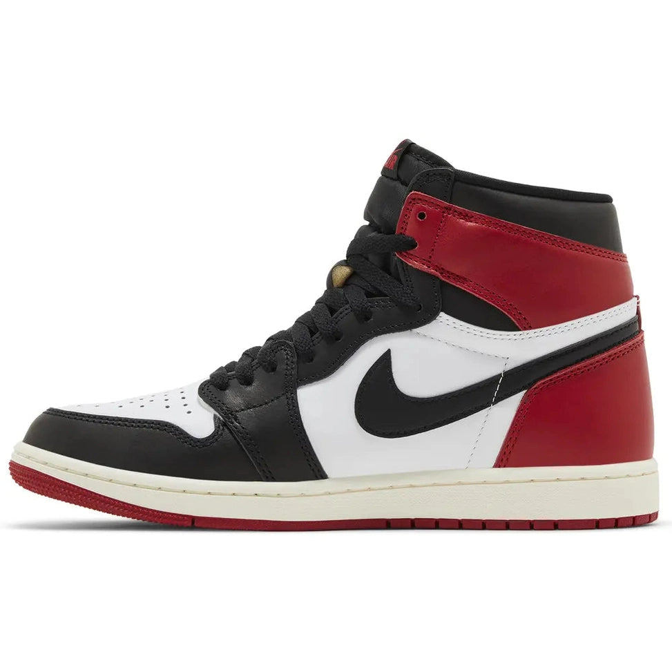 High-top sneaker in black, white, and red leather with black Nike swoosh, side view