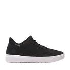 Black sneaker with white sole on a light gray background